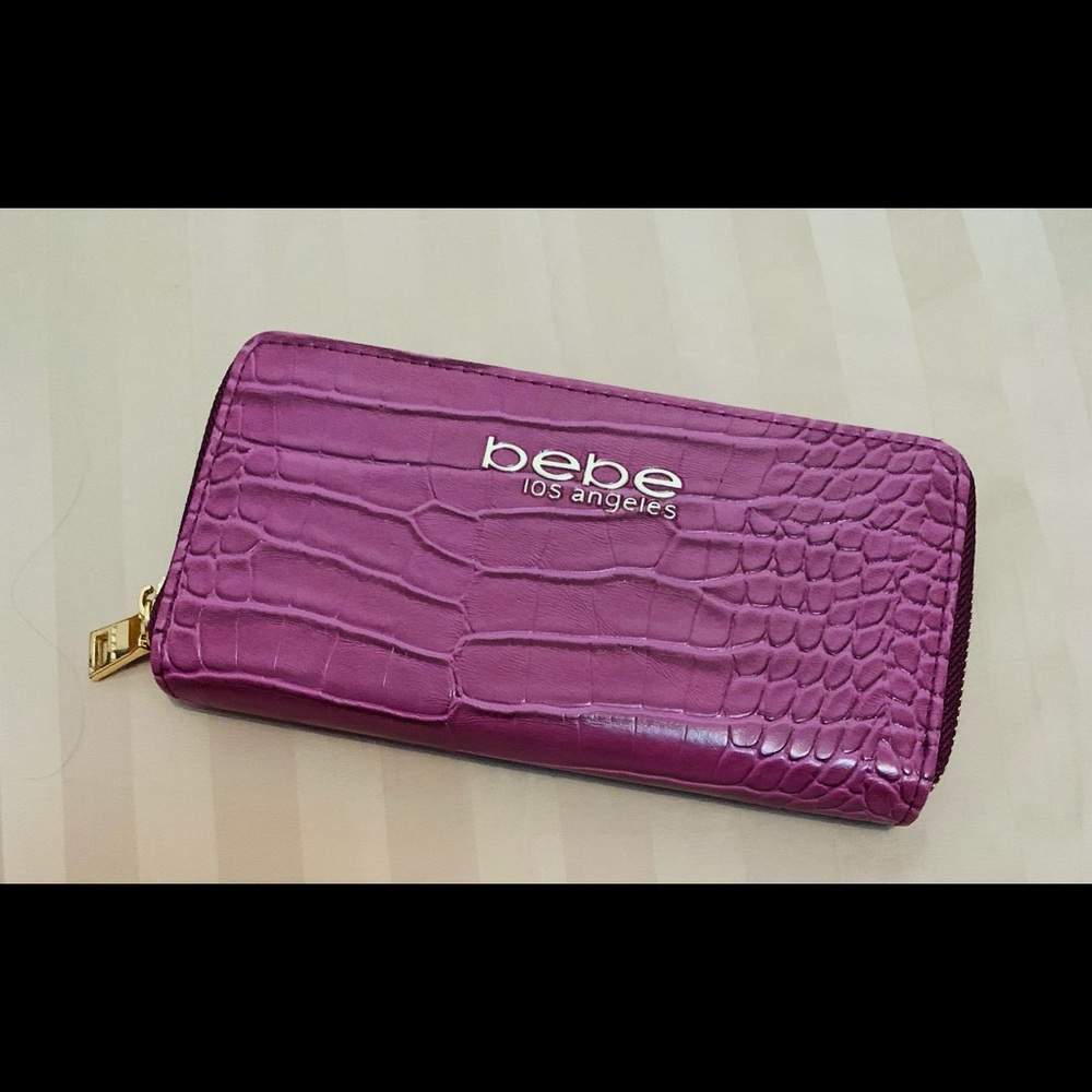 Mauve/berry colored BeBe Los Angeles wallet